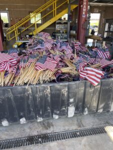 Flags in containers ready to be bundled